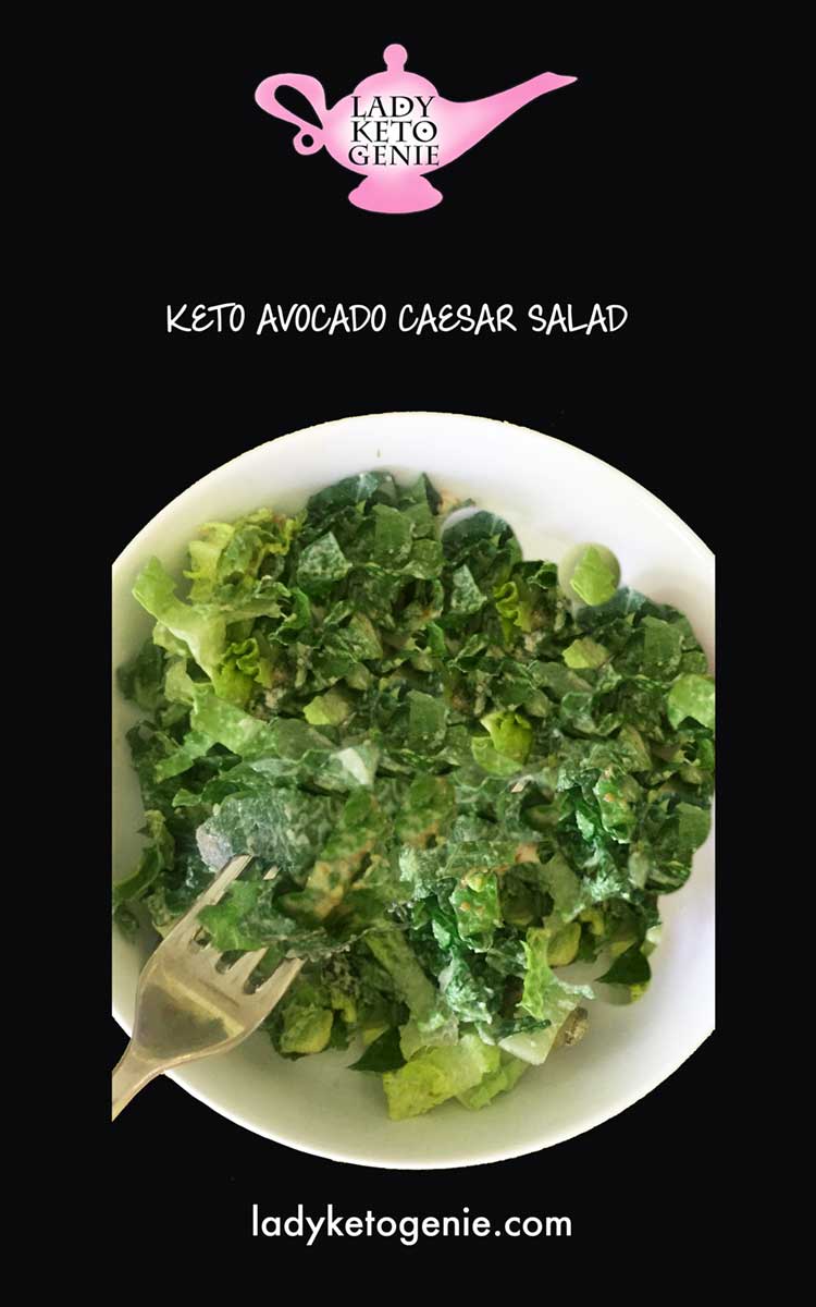 photo of avocado caesar salad on a black backdrop with lady keto genie logo and web site address