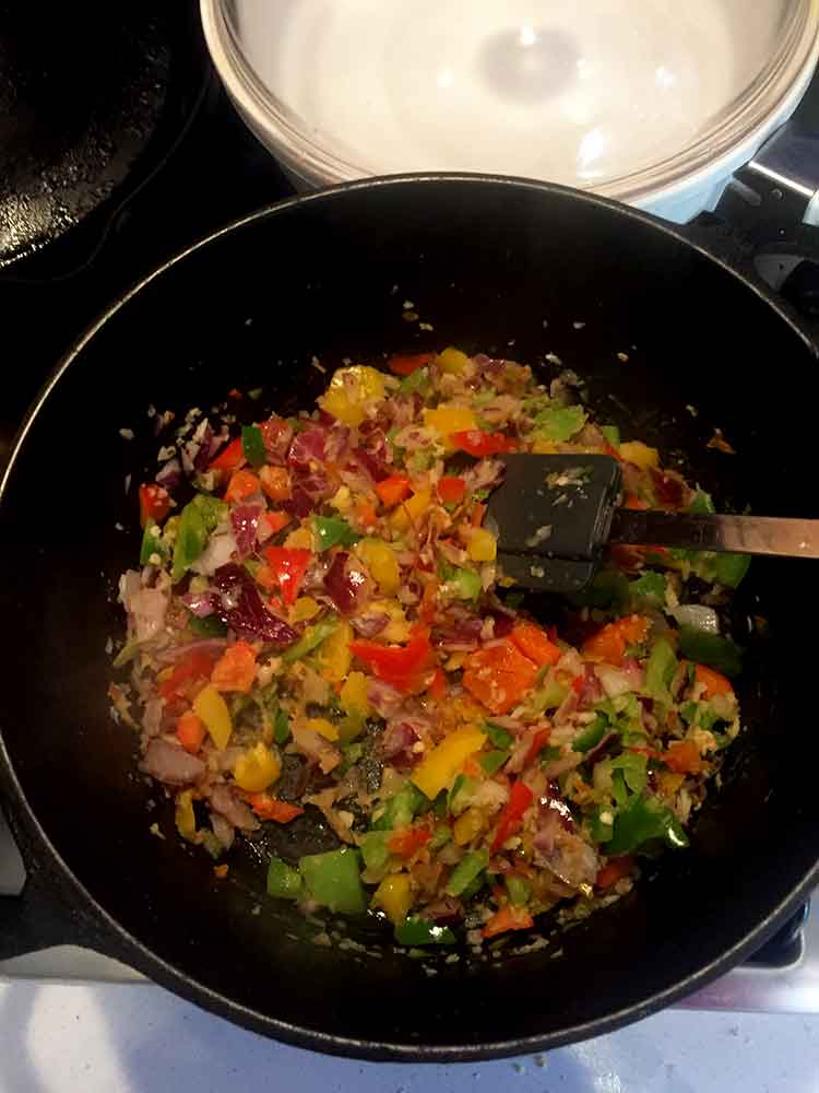 photo of peppers cooking in pot: KETO-CAULIFLOWER-EGG- FRIED- RICE